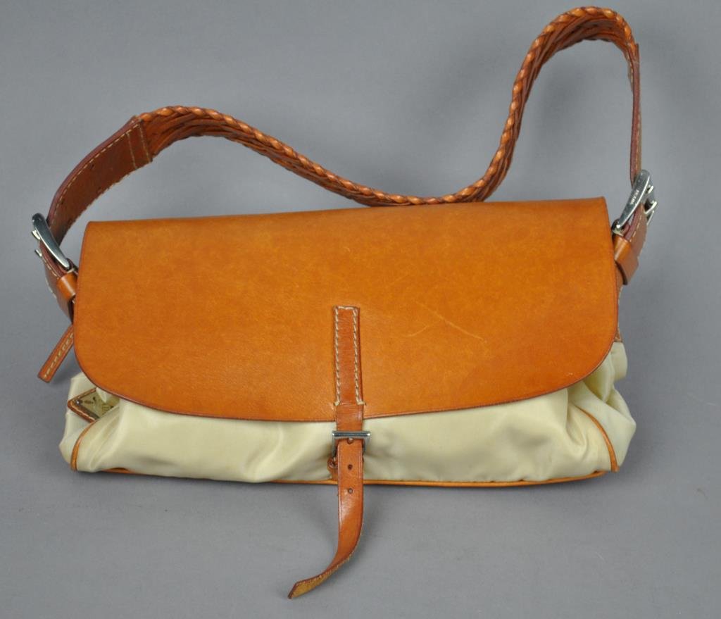 SMALL PRADA ITALIAN HANDBAG: in beige with brown leather trim and braided leather strap, used condition with general wear, 5x10in. (excluding strap)