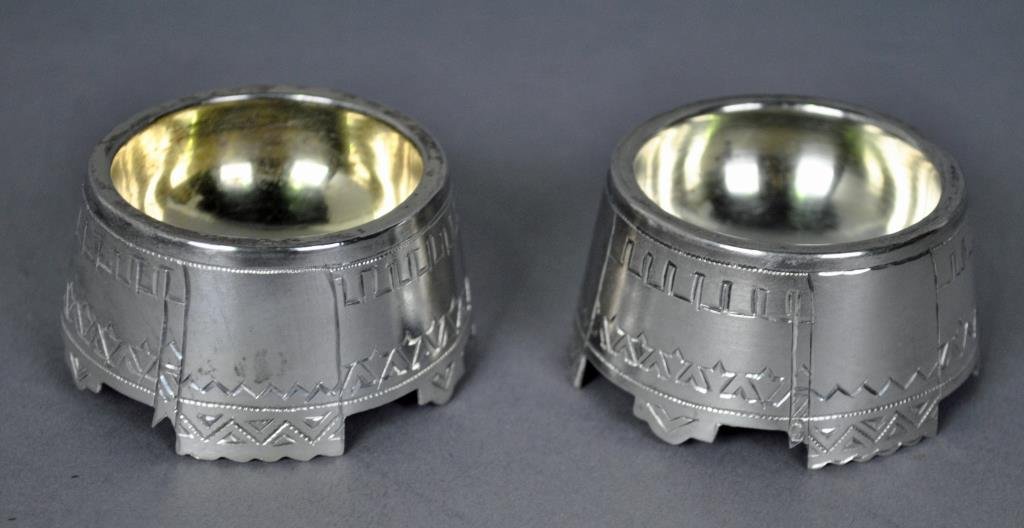 PAIR RUSSIAN SILVER SALT CELLARS: geometric exterior decoration, St. George Moscow mark, assay AA/1888, 84 punch for 875 silver, 2.2ozt.