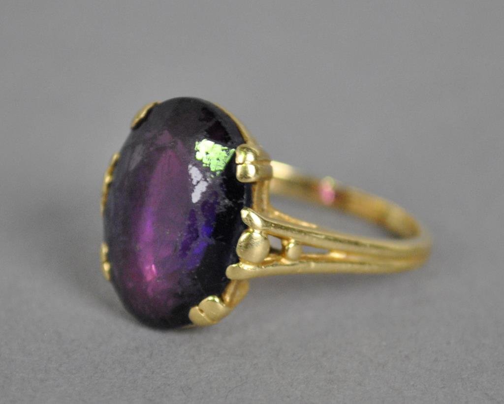 14K AMETHYST RING: set with an oval amethyst approx. 16x11x6mm, yellow gold setting stamped 14K, 6gms. (stone moderately abraded)