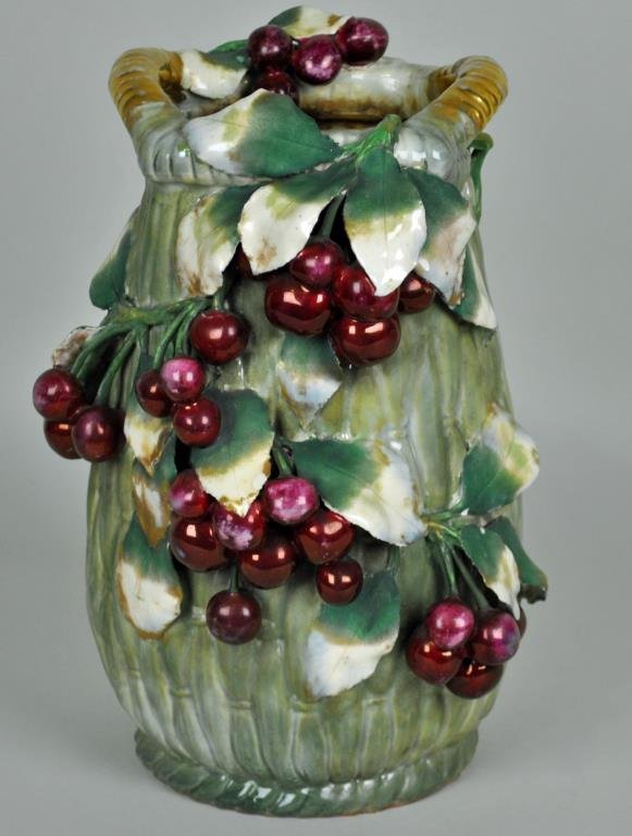 AMPHORA GRAPE CLUSTER VASE: basket weave design, gilt handles, impressed crown mark, stamped Austria / Amphora, 13in., some minor chips/flakes, hairline to one leaf, some wear, Opening Bid: $300/