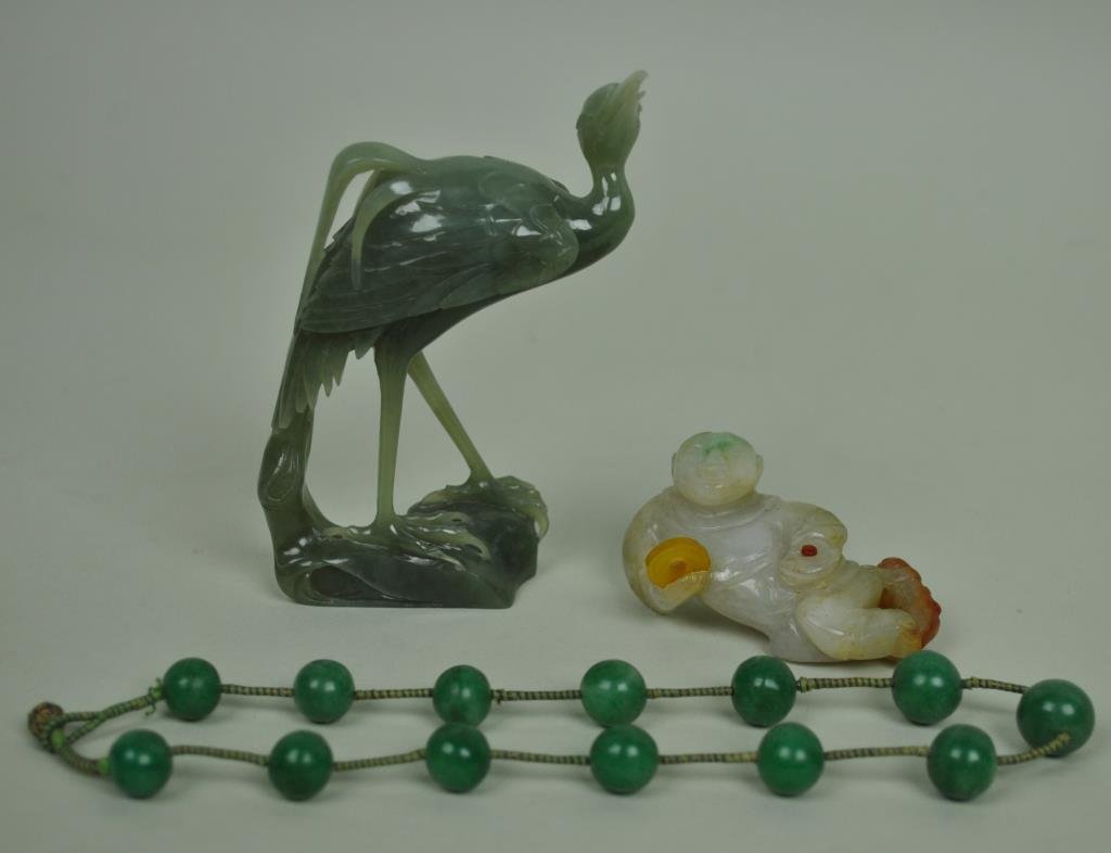 (3) CHINESE CARVED JADE ITEMS: including a reclining figure holding a disc, a 4.5" standing heron (chip to end of beak, not visible in lead photo, and very minor feather chip), and a 15" graduated bead choker on cord