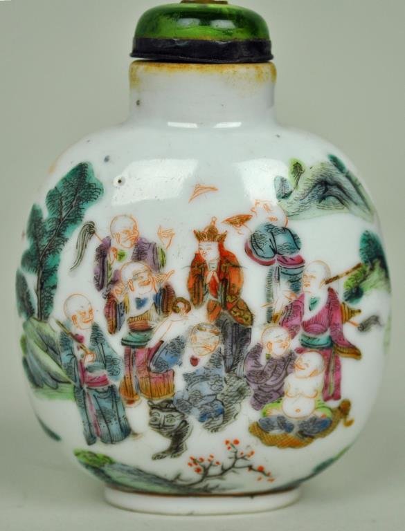 FAMILLE ROSE 18-LUOHAN PORCELAIN SNUFF BOTTLE: Republic period or earlier, decorated in a continuous scene of the eighteen Buddhist luohan against a white ground, 3.25in.