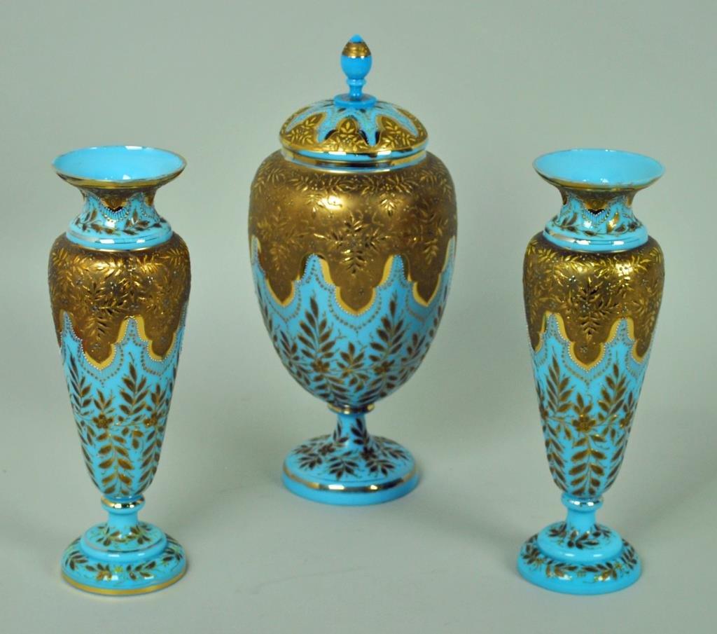 VICTORIAN BRISTOL GLASS GARNITURE SET: decorated in gilt and enameled beading, comprising a pair of 10" vases and a 13" covered jar, some wear to gilding