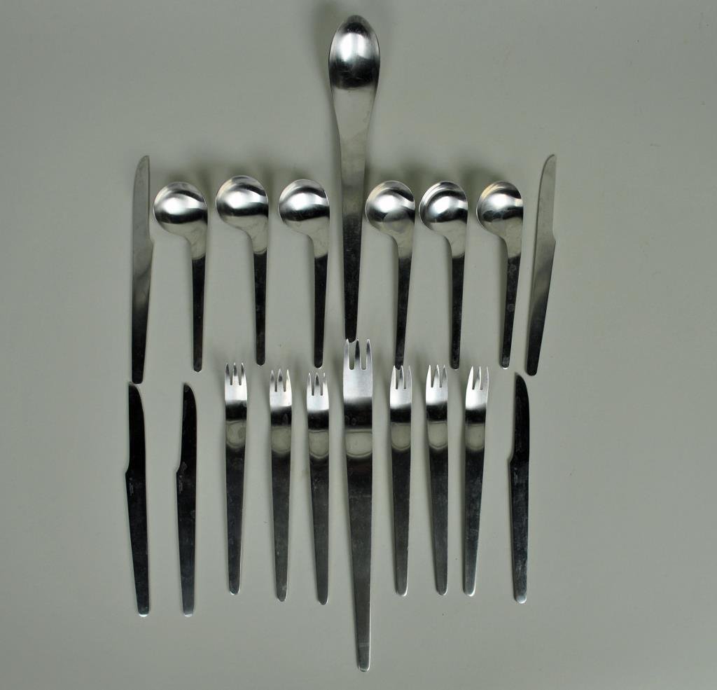ARNE JACOBSEN FOR A. MICHELSEN 'AJ' FLATWARE: 19-piece partial stainless set includes: 6 forks, 6 soup spoons, 4 serrated knives, a butter knife, and a salad serving fork and spoon set, marked A. Michelsen Denmark