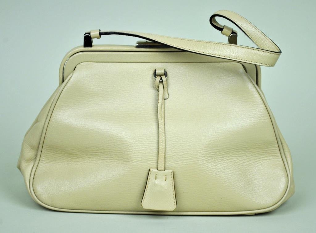 PRADA BEIGE LEATHER HANDBAG: with lock and key, 7.5x12in.