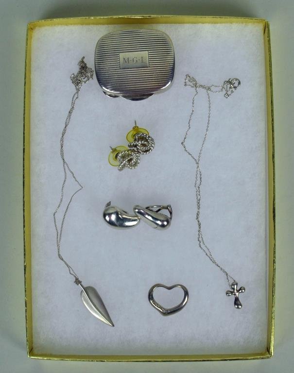 TIFFANY & CO. STERLING JEWELRY GROUP: signed Elsa Peretti pieces include a pair of bean earclips, a floating heart pendant, and a 15" neckchain, a pair of lover's knot pierced earrings, a leaf pendant on unmarked 18" neckchain, a cross pe