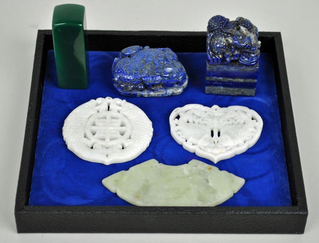 6-PIECE CHINESE CARVED STONE GROUP: including 2 fish design medallions, a fan medallion, a lapis seal, a lapis beast figure, and a green seal (likely malachite), 2.5-4in.