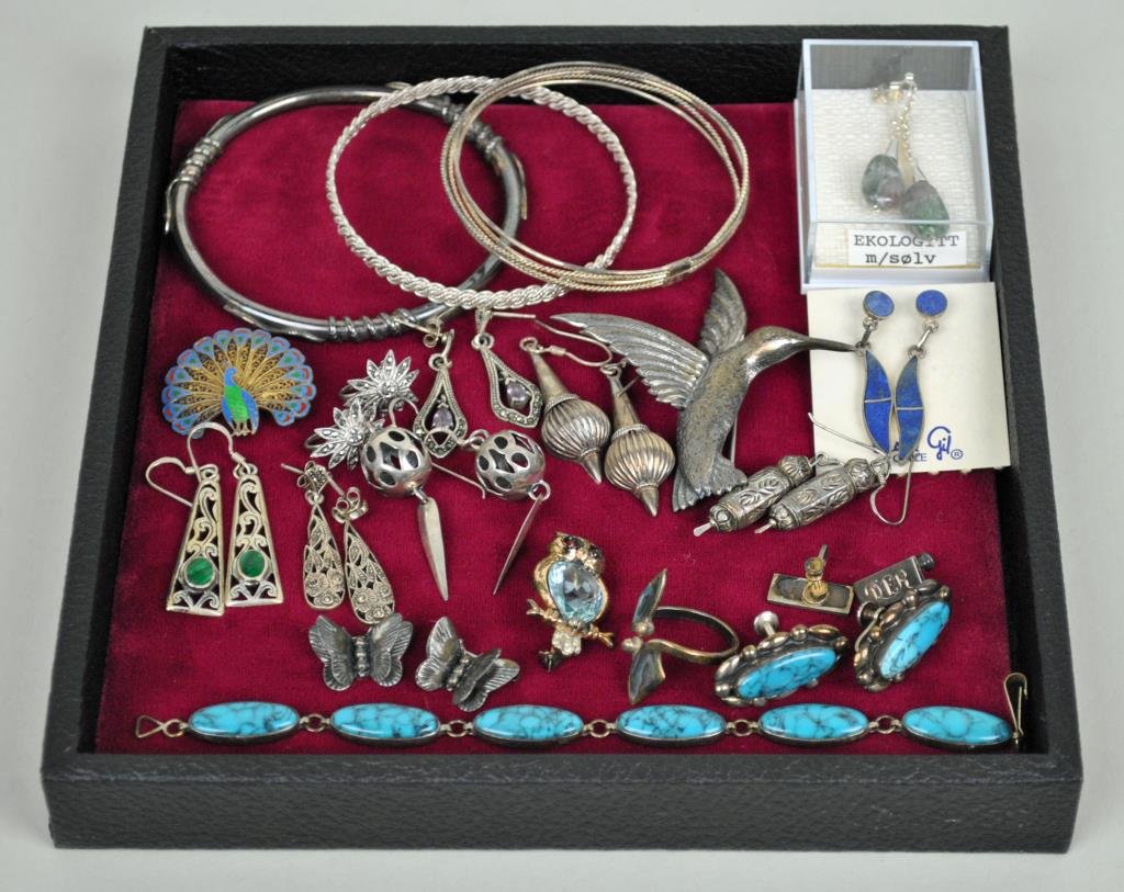 COLLECTION OF STERLING JEWELRY: 32 pieces total, comprising 3 bangles, a 2.75” bird pin, an enameled peacock pin, a jeweled owl pin, a pair of butterfly scatter pins, a turquoise bracelet and screwback earring set, an abalone ring