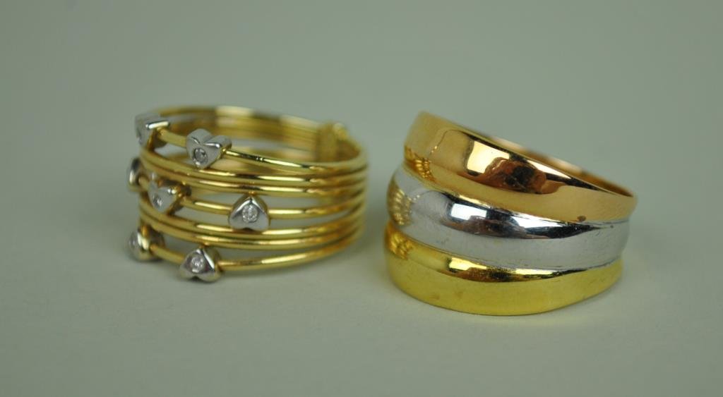 (2) GOLD WIDE BAND RINGS: including an 18K tricolor ring stamped 750 Italy Milor (size 9, light scuffs), and a 14K stacking style diamond accented ring stamped 14K Turkey (size 8.5), 7.1gms.