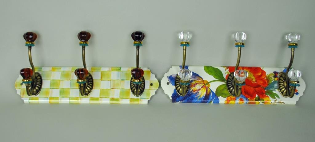 (2) MACKENZIE-CHILDS ENAMEL TRIPLE WALL HOOKS: in Courtly Check and White Flower Market patterns, new condition, each overall 8x17in.