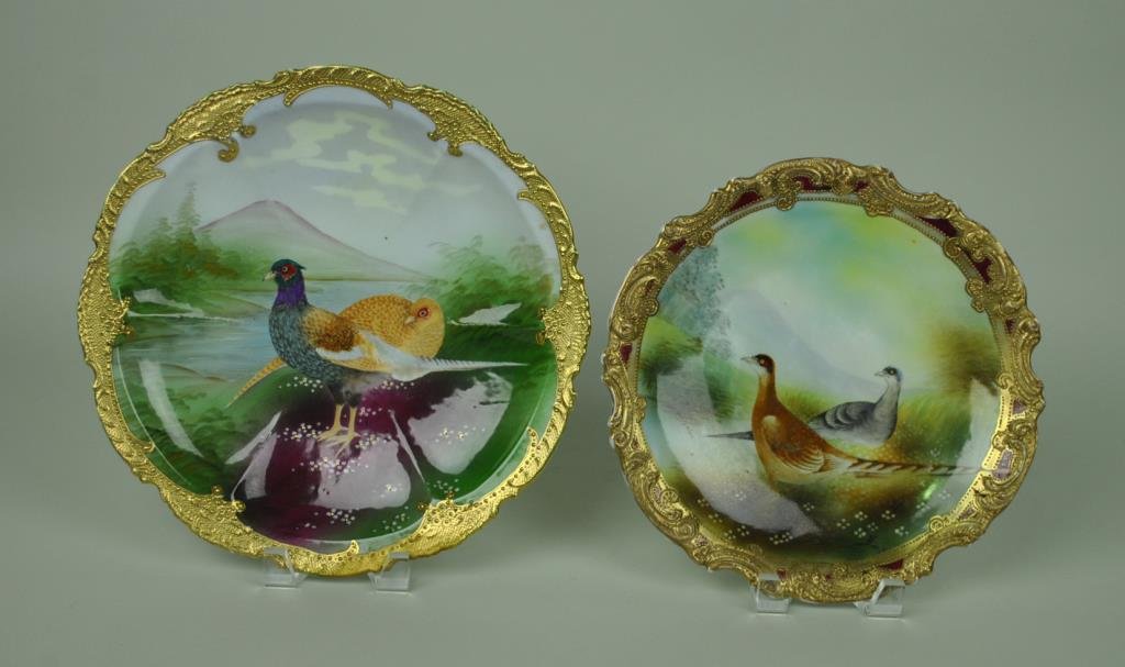 (2) NIPPON PHEASANT SCENIC PLATES: including a 12" plate (restoration to small area at bottom right), and an 11" example with artist signature, each with gilded and beaded decoration