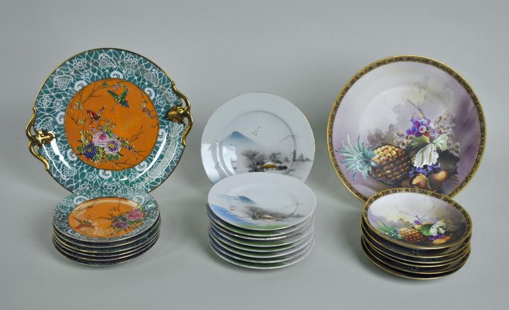 (3) JAPANESE DESSERT SETS: including a 7-piece Nippon set in fruit decoration, a 7-piece Noritake set in floral and butterfly motif (some rubs to luster), and a 9-piece set with painted cottage scenic, 6-10in.