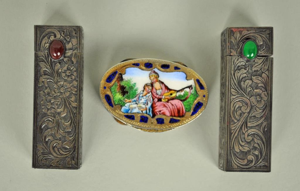3-PIECE VANITY GROUP: including two 800 silver lipsticks, each with hinged interior mirror, 2.25in., and a metalware enameled pill box, 1.75in.