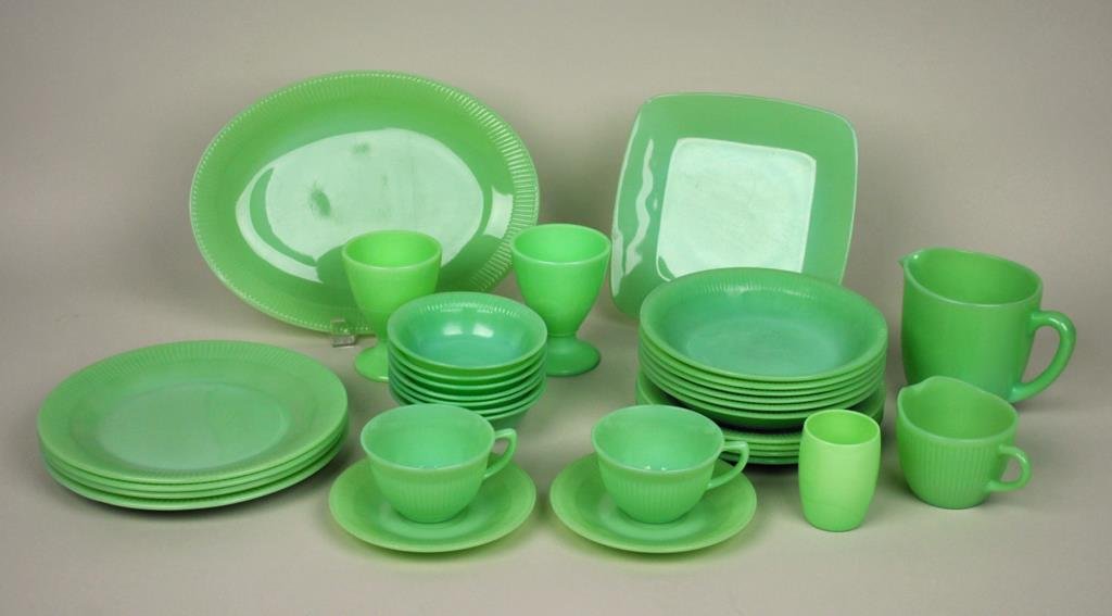 (32) PIECE JADITE KITCHENWARE GROUP: including 4 (9") plates, 4 (7.75") plates, 6 (7.5") shallow bowls, 7 sauce bowls, 2 cups & saucers, 2 footed desserts, a 12" platter, an 8.5" square dish, a large cream pitcher, a creamer and a small