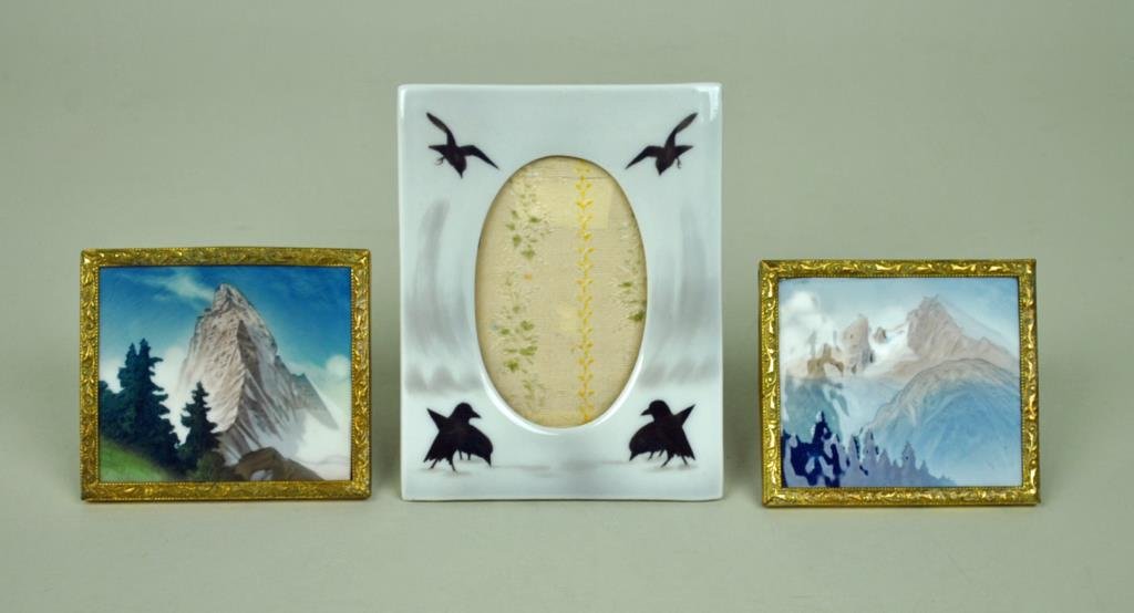 (2) ROSENTHAL MINIATURE PAINTED SCENIC PLAQUES: each 3x3.25, together with a picture frame in crow motif, 5x4in.