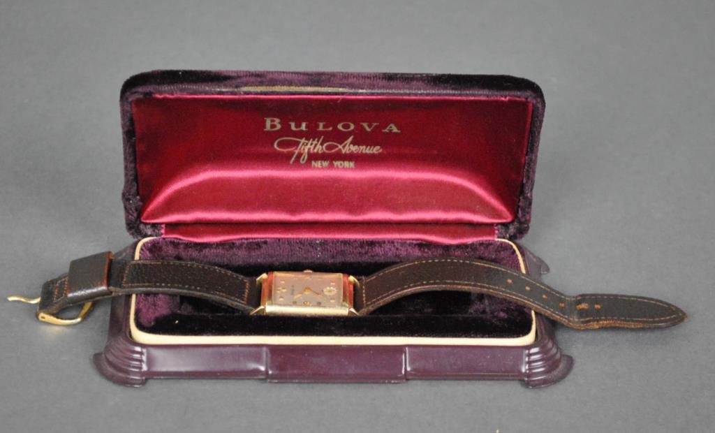 GENTS BULOVA GOLD CASE WATCH: case exterior stamped 14K Gold Bulova #5213902, interior stamped Bulova 14K Solid Gold, movement stamped 21 jewels Bulova 7AK, brown leather band, original velour case (wear), the watch is currently r