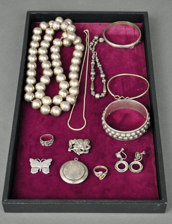 12-PIECE STERLING JEWELRY GROUP: including a 36” large beaded necklace, an 18” thin neckchain, a nouveau-style lady pin, a butterfly pin, rings, bracelets, screwback earrings, and a pendant compact with interior mirror, all marke