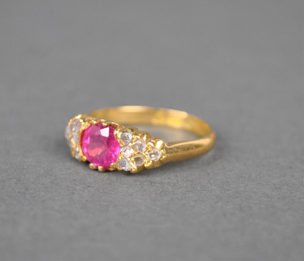 VICTORIAN RUBY & DIAMOND RING: set with a single round ruby, and 12 rose cut diamond melee, yellow gold setting stamped with British hallmarks, tests 18K, size 5, 4.6gms., Estate Collection