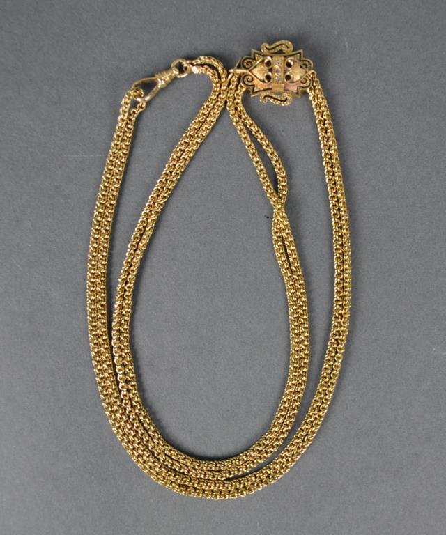 EDWARDIAN GOLD & DIAMOND SLIDE FOB & CHAIN: the cartouche slide fob with suspending lock in black enamel trim set with 3 diamond melee, watch chain measures 26" doubled, clasp stamped 14KT, fob and chain test 14K, 53.3gms.