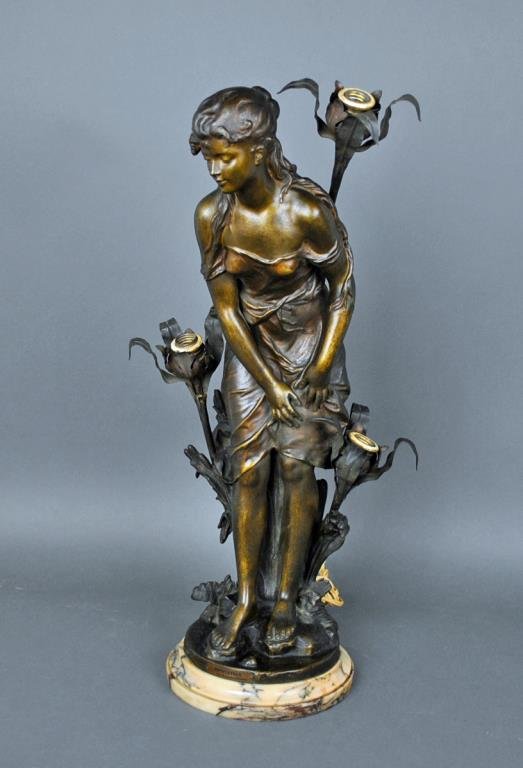 SPELTER FIGURAL LAMP AFTER HIPPOLYTE MOREAU: Hesitation', patinated spelter mounted above a marble base, bearing molded signature of Hip Moreau, 29in., some wear and imperfection, one lamp leaf detached but present