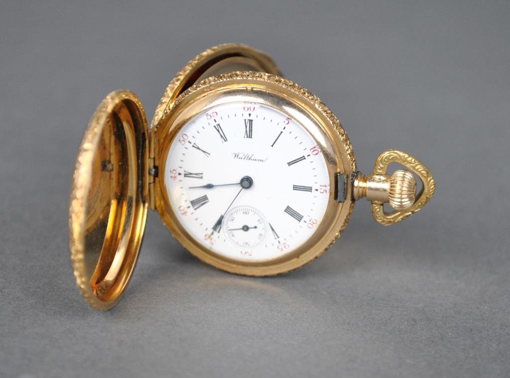 LADIES AMERICAN WALTHAM GOLD POCKET WATCH: yellow gold hunter case stamped 'A.W.C.CO. 14K 63841', movement #8311610, diameter 1.5in., gross weight 41.2gms. (the watch is currently running, however not guaranteed)