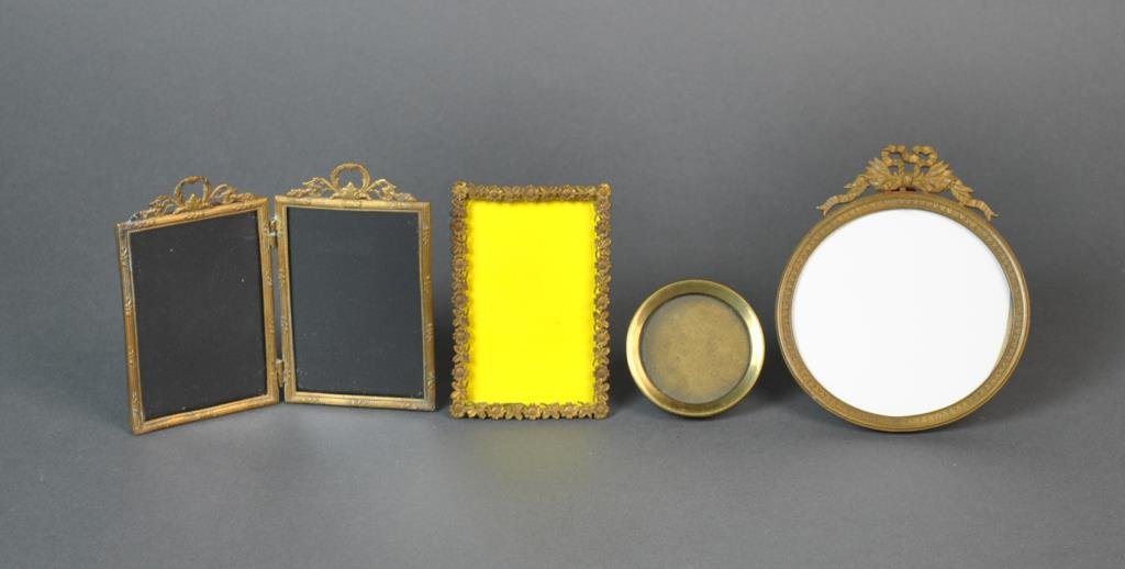 (4) FRENCH BRASS PICTURE FRAMES: all easel backs, one hinged double with hang rings, largest opening size 3.75in. round