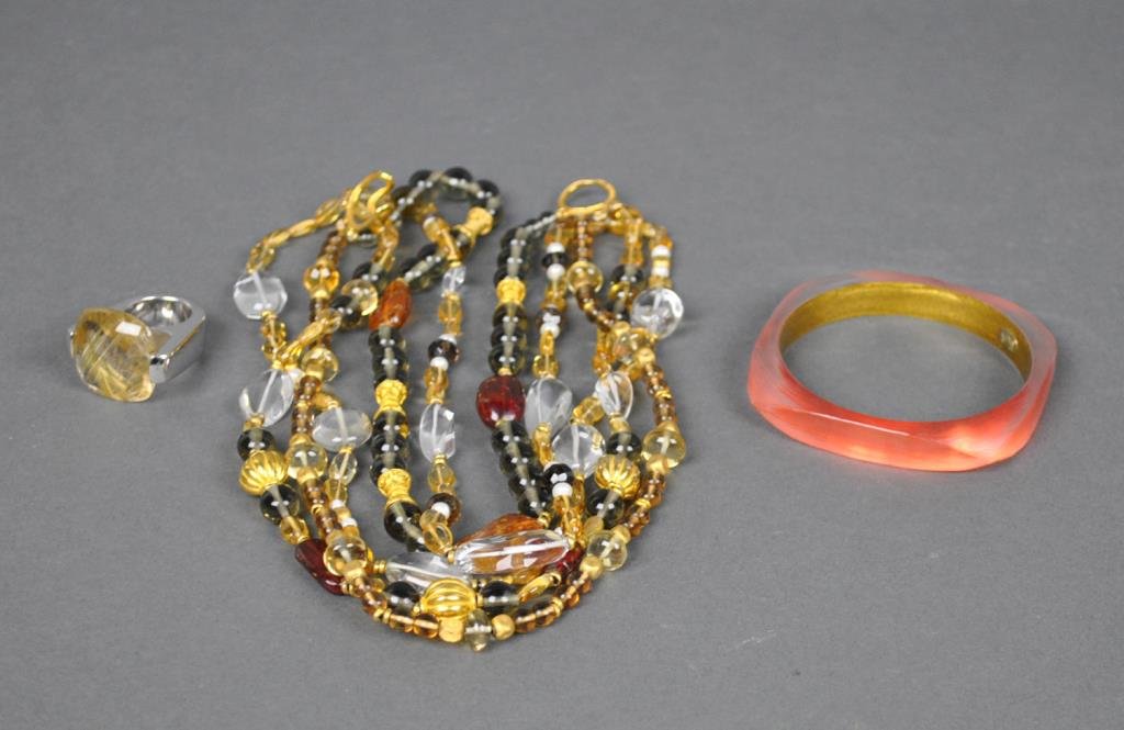 (3) DESIGNER JEWELRY PIECES: including a 17" multi-tier beaded necklace by Jaded, an Alexis Bittar lucite bangle (interior 2.75”), and a sterling rutilated quartz (25mm) ring by Pianegonda, (minor edge nick to stone, silver scr