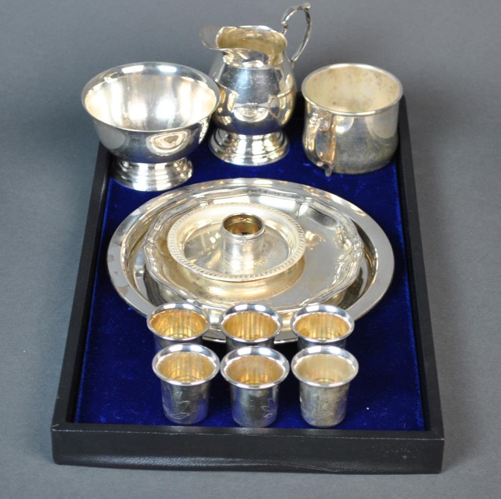 (13) SILVER TABLEWARES: including a footed creamer and sugar, a 7" round tray, a 5" scalloped edge dish, a coaster, a small napkin ring, a baby cup, and a set of six 1.25" cups, all marked or tested silver, 17.8ozt.