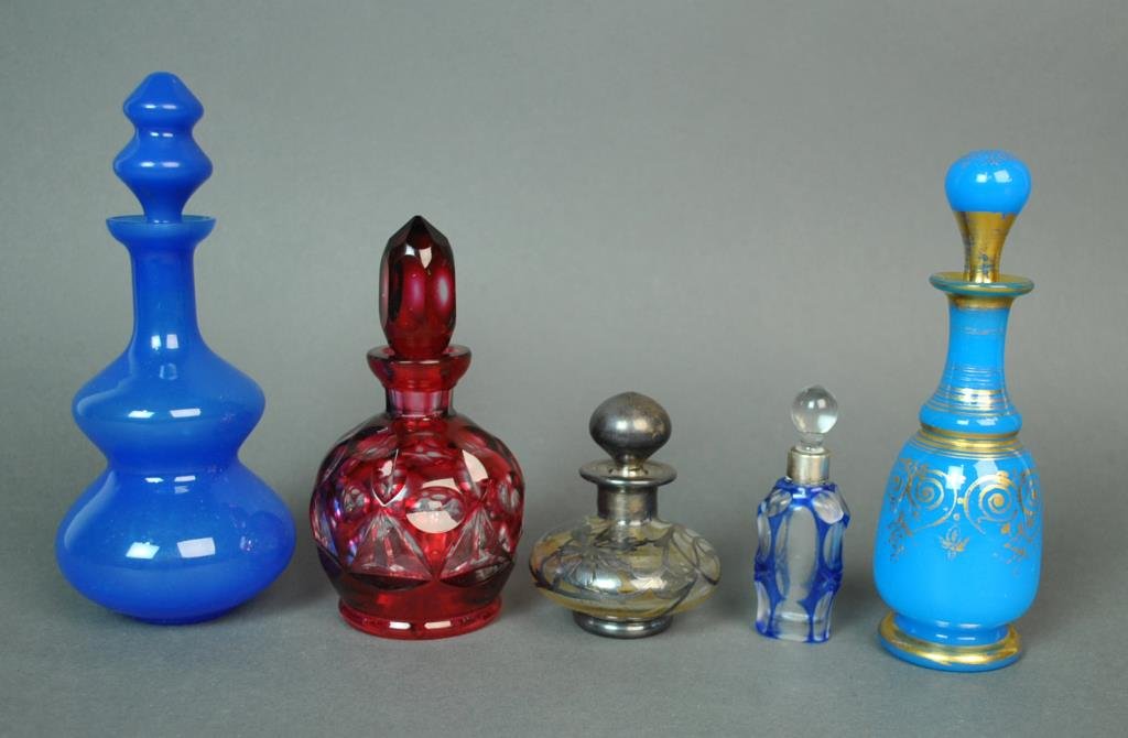 (5) VINTAGE PERFUME BOTTLES: including 2 French blue opaline, a cranberry cut to clear, a small cobalt cut to clear, and a sterling overlay, tallest 8in.