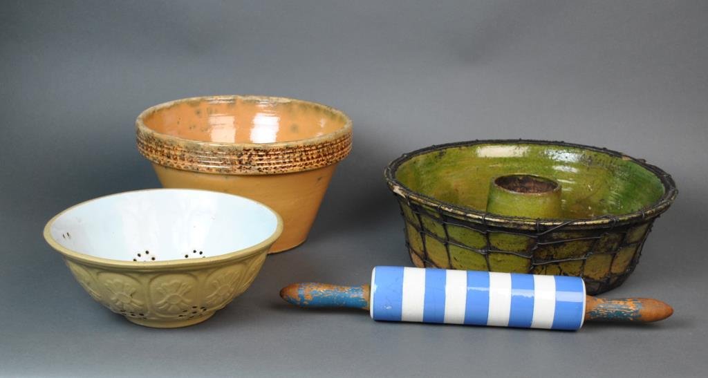 (4) PIECE ANTIQUE KITCHENWARE GROUP: including an as-is wire wrapped French pottery mold, a sponge ware pottery bowl, a pottery strainer, and an English porcelain rolling pin, widest 16in.