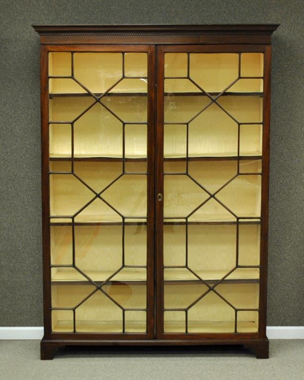 GEORGIAN CHIPPENDALE MAHOGANY BOOKCASE CABINET: c.1770, solid mahogany, double doors, glazed glass (one pane damaged), 4-shelf interior, dentil work cornice, bracket feet, 78x56x16in. Provenance: Mill House Antiques, 1984.