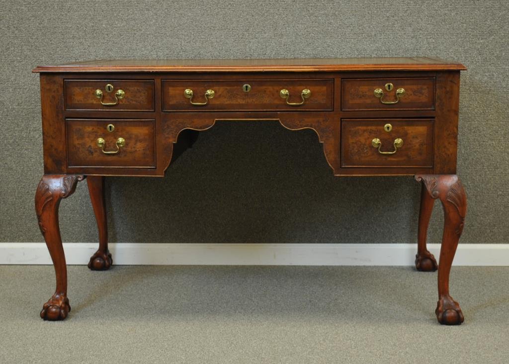 ENGLISH GEORGE II STYLE YEWWOOD DESK: c.1860, 5-drawer front, verso with 4 faux drawers and a center drawer opening to a leather writing surface, leather inset top (surface wear and scuffs), ball and claw feet, 31x51x28in. Provenance: Mil