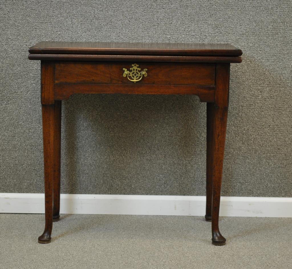 GEORGE II MAHOGANY FOLD OVER TEA TABLE: c.1740, single-drawer, pad feet, Authentication Certificate reads: â€œThe above item has been examined and authenticated in England where its date of production was determined as being circa 1740,