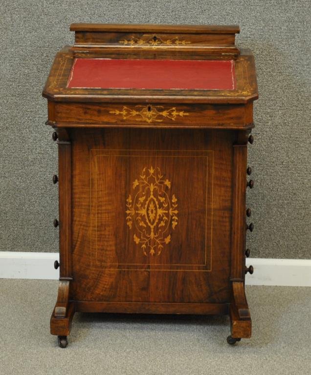 VICTORIAN INLAID MAHOGANY & WALNUT DAVENPORT: with marquetry and string inlay, leather inset writing surface, on casters, 32x21x21in. Condition: Inlay loss, interior lid wood crack, loose edges and wear to leather inset