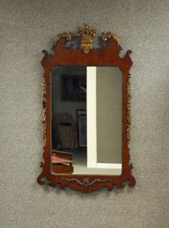 KINDEL MAHOGANY & GOLD PAINTED WALL MIRROR: 20thC., Federal style, floral crest and garlands (separations to garlands), Kindel label, 46x27in.