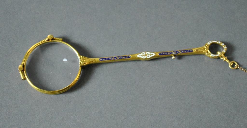 ENAMEL DECORATED & GOLD PLATED LORGNETTE: unmarked, on 13" tested 10K gold chain, 4.4gms.