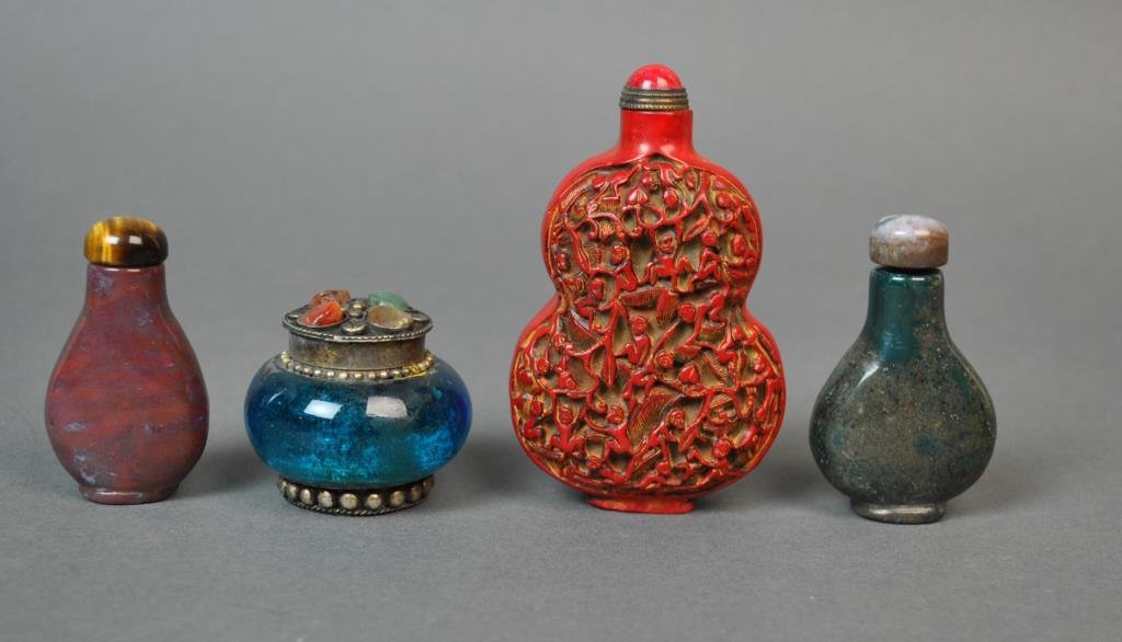 (3) CHINESE SNUFF BOTTLES AND A SNUFF BOX: 20thC., including a large cinnabar or cinnabar-style example in carved monkey design (minor base nick), 4in., 2 hardstone snuff bottles, 2-2.5in., and a snuff box with hardstone inset lid, 1.5in.