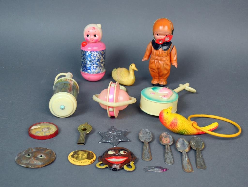 (18) ASSORTED VINTAGE TOYS / CHILD'S COLLECTIBLES: including a Japanese celluloid pilot, plastic rattles, a Deputy Marshall Wild Bill Hickok badge, a Shirley Temple mirror, etc.