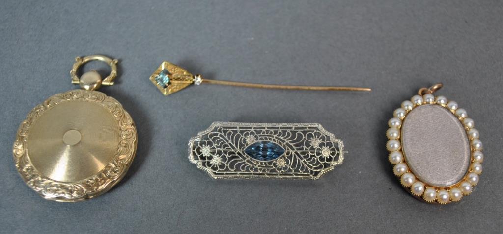 (4) PIECE GOLD JEWELRY GROUP: including a stamped 10K white gold filigree bar pin with blue stone, 1.5in., a tested 14K locket pendant containing hair art, 1.5in., a tested 10K seed pearl locket pendant, and a stamped 10K lapel pi