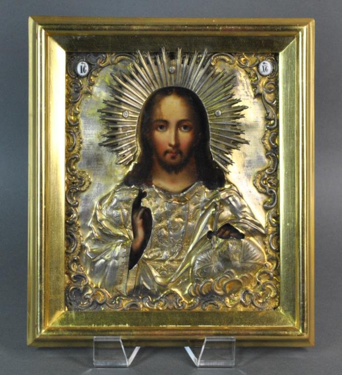 RUSSIAN ICON OF CHRIST REDEEMER, MOSCOW, 1856: oil or tempera on panel, overlaid with a silver gilt repoussed and chased riza, hallmarks of 84 Silver Standard, Moscow Assayer ‘AK’ - Andrey Antanovich Kovalsky, 1856, and with unidentified maker