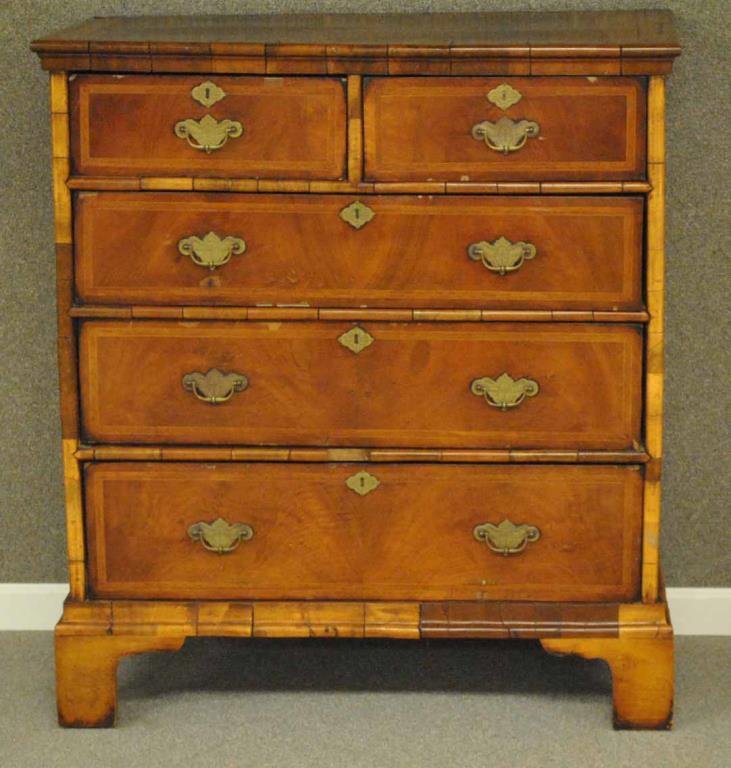 ENGLISH GEORGE II STYLE INLAID WALNUT CHEST: 18th/19thC., having two short drawers above three long drawers, in walnut veneer with cross banding, dovetailed drawers, faux escutcheons, replaced brass pulls, on bracket feet, 43x38x19in. Condition: