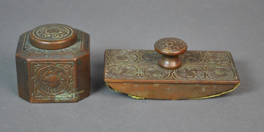 TIFFANY BRONZE ZODIAC PATTERN INKWELL & BLOTTER: each signed Tiffany Studios New York, inkwell #1077 (glass insert as-is), height 3in., blotter #990, length 5.5in.