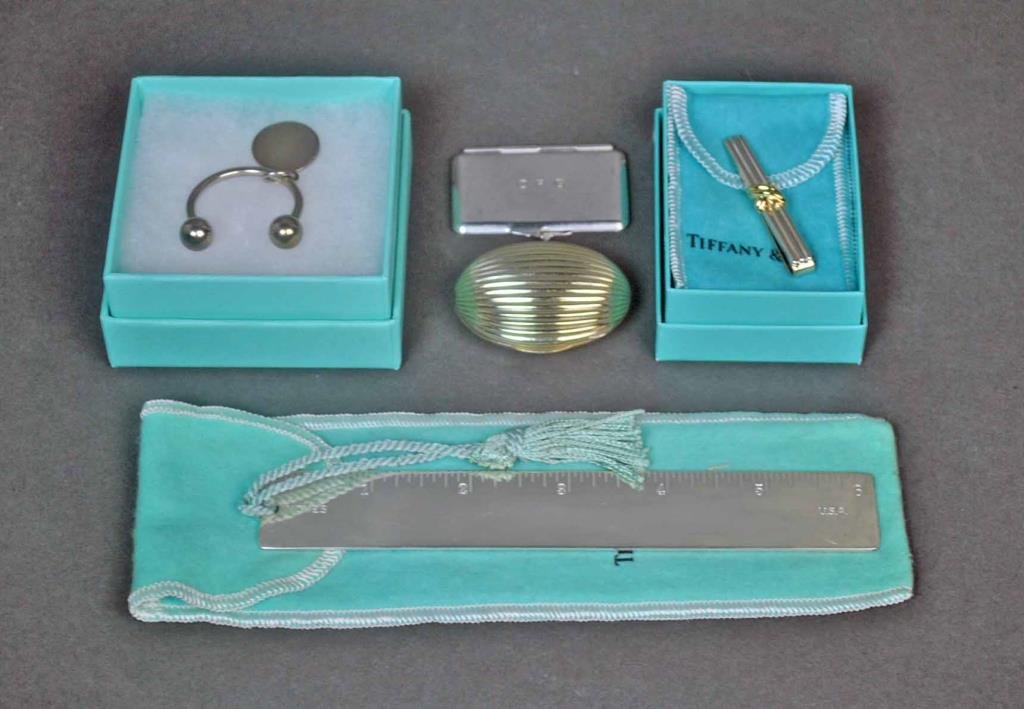 (5) TIFFANY & CO. STERLING ITEMS: including a 6" ruler bookmark, a key ring, and a signature tie clip with 18K 'X', and 2 vintage hinged trinket boxes, one a ribbed clam shell example with vermeil interior, the other with monogram, al