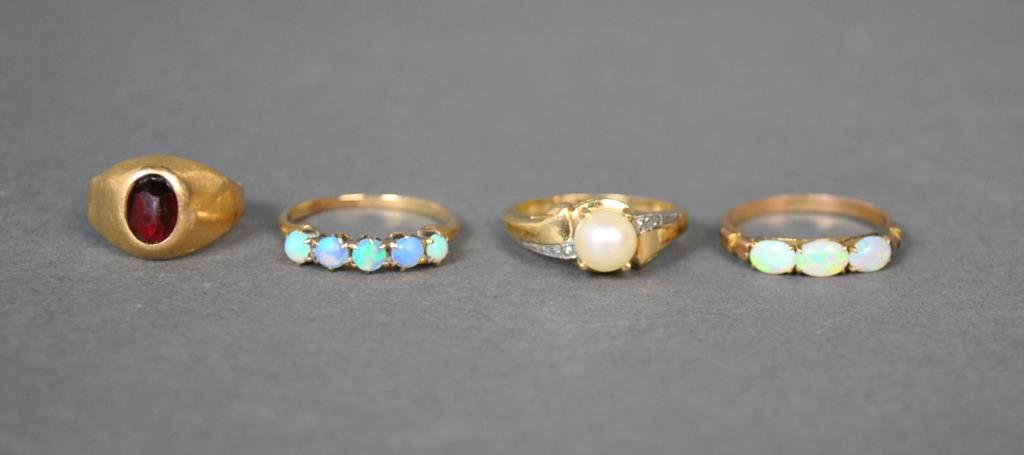 (4) GOLD & GEMSTONE RINGS: including 2 opal rings (10K & 14K), a 14K cultured pearl ring, all size 6.5, and an 18K red stone ring (likely garnet), size 4.25, all stamped or tested, gross weight 8.2gms.