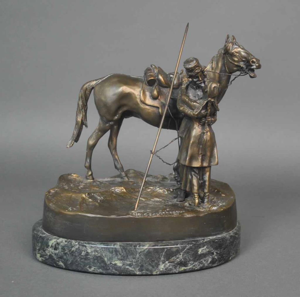 A BRONZE GROUP OF A DEPARTING COSSACK: cast after the model by Vassili Grachev (Russian, 1831-1905), 20thC., C.F. Woerffel foundry mark, St. Petersbourg, inscribed on base in Cyrillic, overall 9x8in.