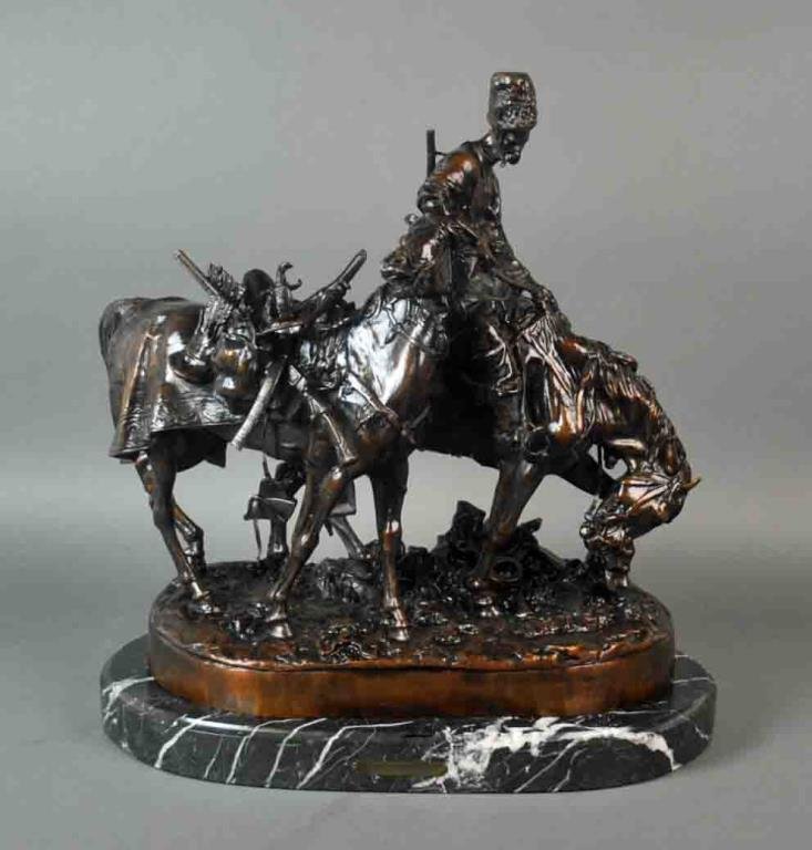 A LARGE BRONZE GROUP OF A COSSACK AFTER BATTLE (1 of 6)