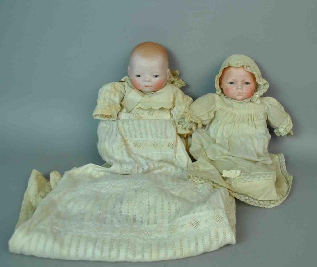 (2) BISQUE BYE-LO BABIES: each with sleep eyes, composition hands, cloth bodies, one with blue eyes, head incised with Arthur Schoenau & Hoffmeister mark, Made in Germany, one with brown eyes, head incised Grace S. Putnam, Mad