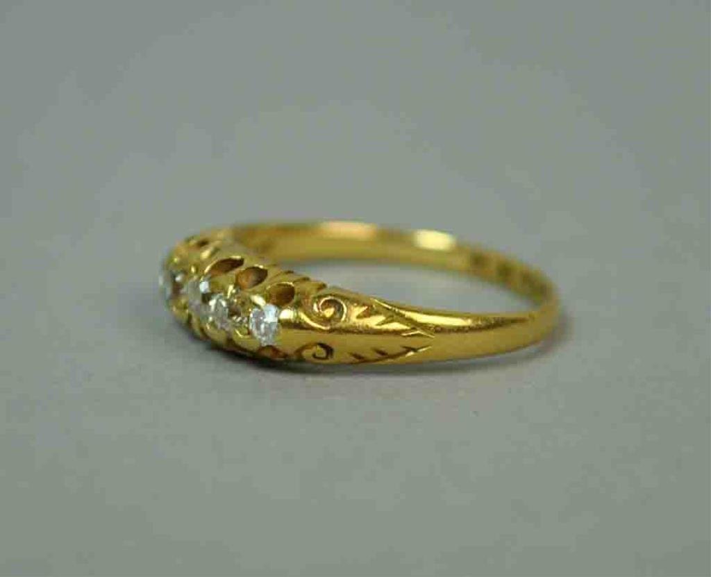 EDWARDIAN 18K DIAMOND RING, 0.15CTW: set with 5 diamond melee approx. 0.15 carats, yellow gold setting with hallmarks for Chester, England, 1913, 18K, size 6, 2.9gms.