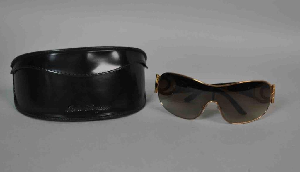 SALVATORE FERRAGAMO LADIES DESIGNER SUNGLASSES: in original case, with rhinestone accent design, marked 'Salvatore Ferragamo, Made in Italy, 1151-B 705/13 120 3N', width 5.5in., depth 5in.