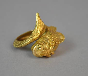 18K ILIAS LALAOUNIS FISH FORM RING: yellow gold setting stamped 'Ilias Lalaounis K18 Greece', overall height from fin to tail 24mm, size 5+, 9.9gms.